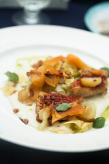 Roasted fish with vegetables and green oil