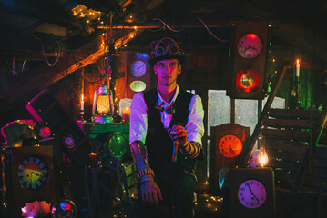 Steampunk cosplay. A male inventor in a suit, a top hat with a cane