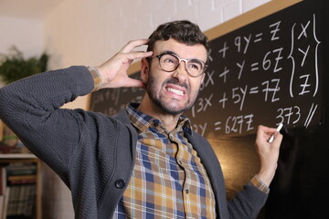 Math teacher with a puzzled expression