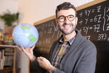 Cute geographer showing the world 