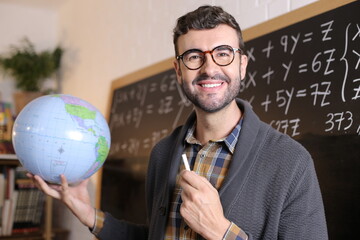 Cute geographer showing the world