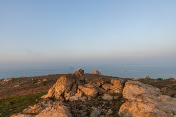 The early morning of camping Island, rocks and sunshine form a beautiful scenery