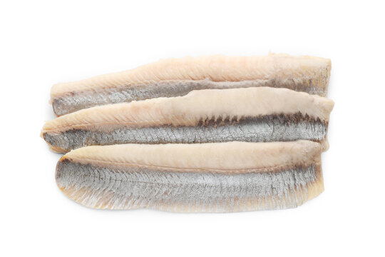 Delicious salted herring fillets on white background, top view