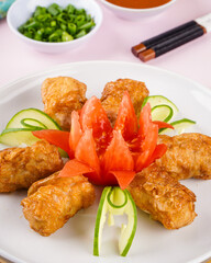 Assorted Chinese Dimsum in bamboo basket. Dimsum is a large range of small dishes that Cantonese people traditionally enjoy in restaurants for breakfast and lunch.