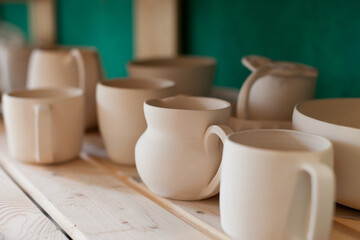 ceramic neutral color clay tableware on the shelf 