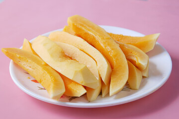 slice of papaya on white plate ,