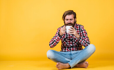 Hold cup of coffee or tea. lifestyle concept. handsome hipster man with cup of coffee. he is taking a coffee break. Handsome mature guy drinking from cup