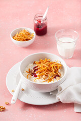 rice pudding with Norwegian brunost traditional brown cheese and raspberry jam