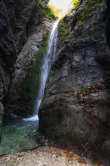 Waterfall in the Lacerno Gorges, Italy. The waterfall that feeds the river that digs into the millenary rock.