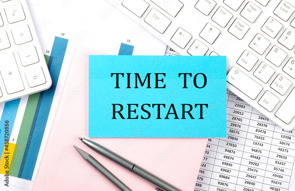 Poster time to restart text on blue sticker on chart with calculator and keyboard,business