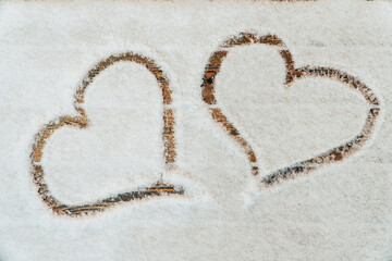 A heart drawn with a finger on the snow