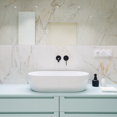 Stylish bathroom washbasin and blue drawers
