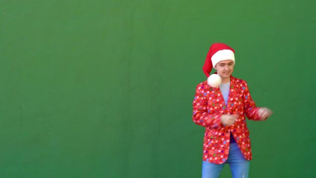 Young Caucasian man dancing while dressed in Christmas costume
