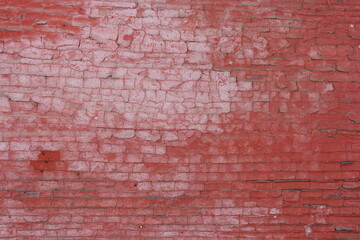 Fototapeta na wymiar Old cracked red paint background
