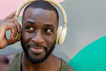 Portrait of smiling handsome man with headphones