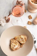 stewed pear with brie cheese in pink wine