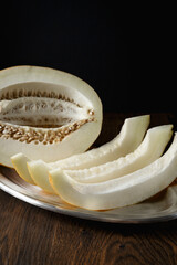 Melon, honey melon on wooden table background.