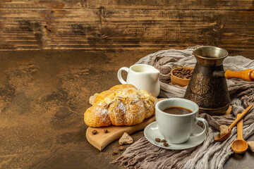 Coffee and croissant, good morning and breakfast concept
