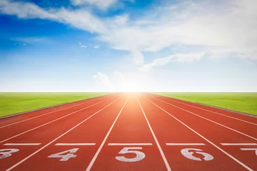 Foto op Plexiglas Athlete running track with number on the start. Day scene © jayzynism