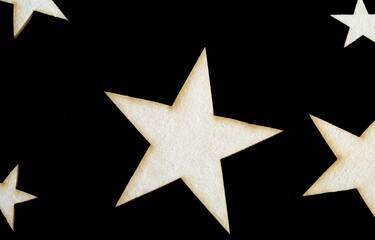 Stars made of wood on a black background