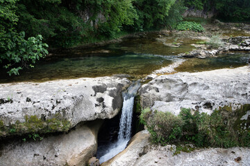 Georgia, mountains and waterfall, rocky terrain.