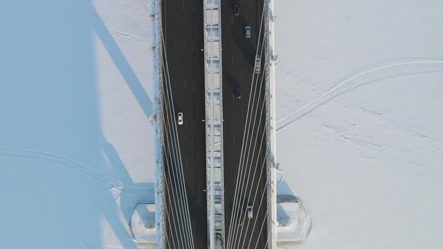 Aerial view of the Western High-Speed Diameter in winter, frozen river Neva in winter.