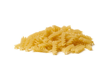 Heap of raw fusilli pasta isolated on white background