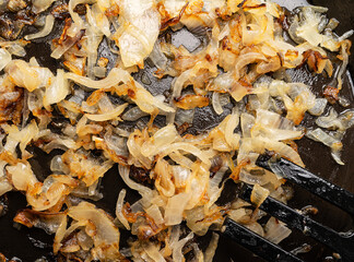 Fried onion close-up with a fork