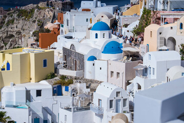 Panoramic view of Oia town cityscape at Santorini island in Greece. Traditional white houses. Greece, Aegean sea. Famous European destination
