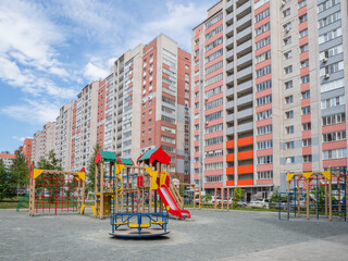 Fototapeta na wymiar Childrens Playground in the courtyard of a new residential area.