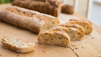 fresh loaf of bread on wooden board