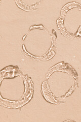 pattern of face serum circle swatches on a beige background