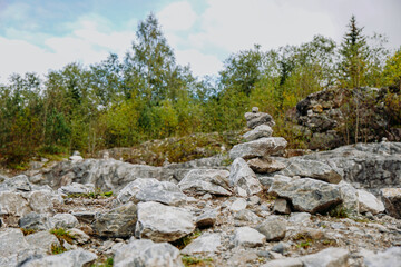 A lot of stone cairns at former marble quarry in Ruskeala, Karelia, Russia. Stone turret