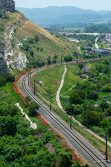 Fototapeta na wymiar railway at the foot of the cliff