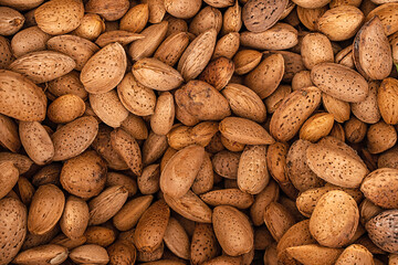 Background of unpeeled almonds in a shell