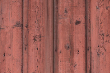 Natural pattern and texture of rough and old red painted wood planks surface.