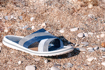 beach slipper on a sandy beach on a summer day