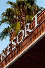 the inscription resort on the hotel building on a background of palm trees