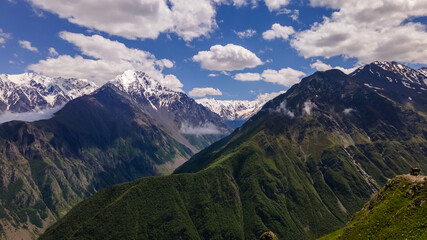 Fototapeta premium Mountain Ridge of Caucasian Range Partly Covered with Snow. Aerial View