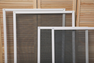 Set of window screens near wooden folding screen