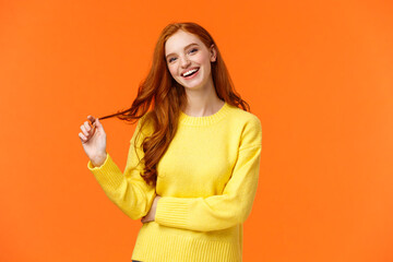 Carefree good-looking, smiling toothy redhead woman, girl with ginger hair laughing as chatting...