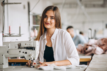 Woman tailor working at the sewing factory