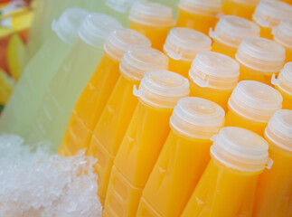 Freshly squeezed orange juice and guava juice are packed in ready-to-drink plastic bottles.