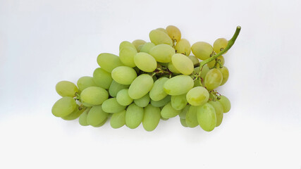 A bunch of green grapes on a white background. Ripe grapes from my garden.