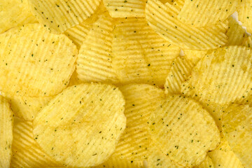 Potato chips with green onion and sour cream isolated on white background.