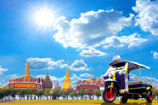 Three wheel native taxi (Tuk Tuk) vehicle urban at  the Grand Palace in Bangkok, Thailand.