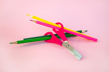 Colorful school supplies on pastel pink background. Back to school concept.