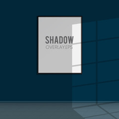 Windows shadow overlay scene and a potrait frame in the room wall