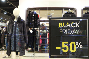 Sale in the store concept. The word SALE in the shop window.