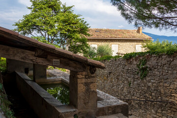 Fototapeta na wymiar Lavoir, typical historical public laundry place in Crestet, Vaucluse, Provence, France, Europe